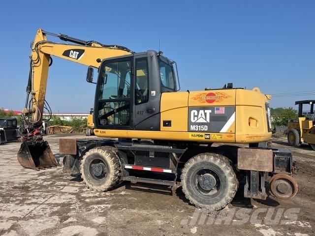 CAT M315D Колісні екскаватори