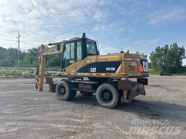 CAT M318D Колісні екскаватори