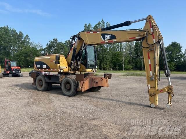 CAT M318D Колісні екскаватори