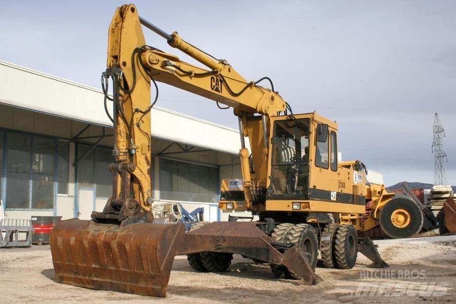 CAT 214B Колісні екскаватори