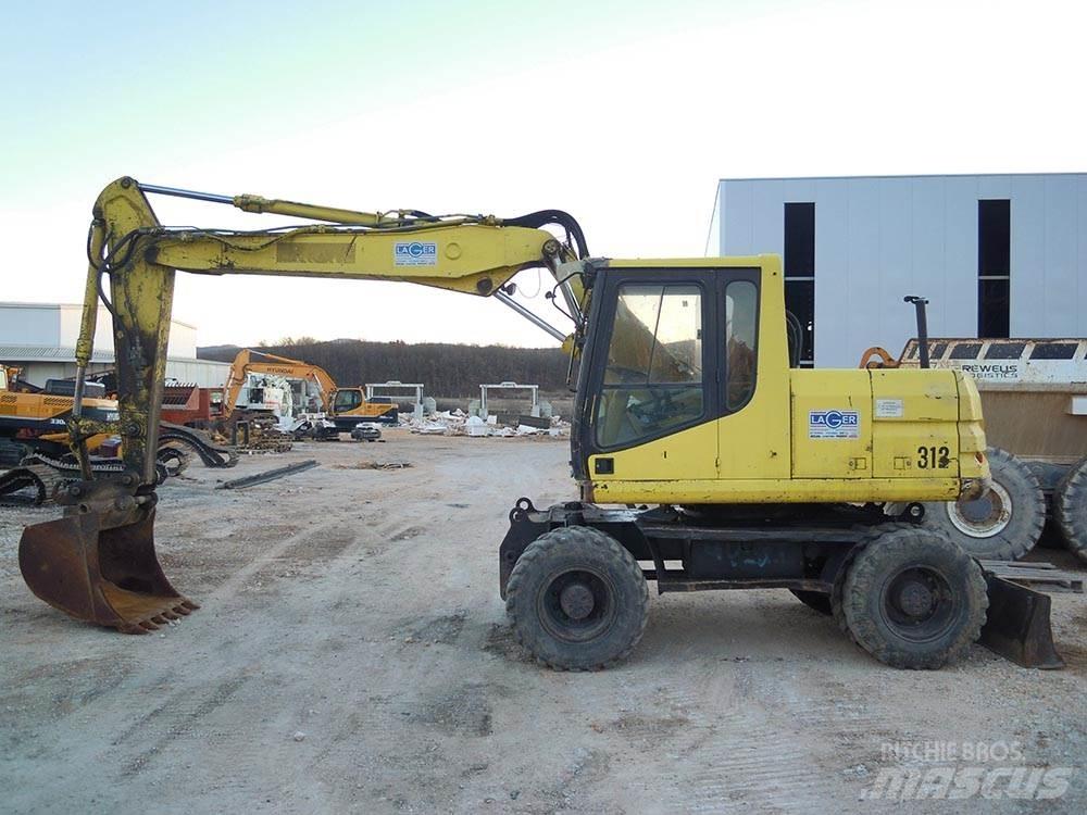 CAT M312 Колісні екскаватори