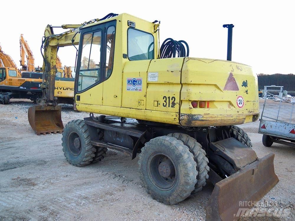 CAT M312 Колісні екскаватори