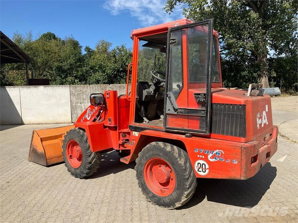 Fai 556 Фронтальні навантажувачі та екскаватори