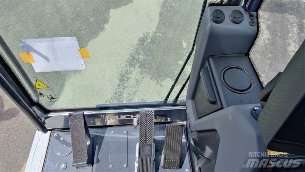 Fuchs MHL 320 Колісні екскаватори