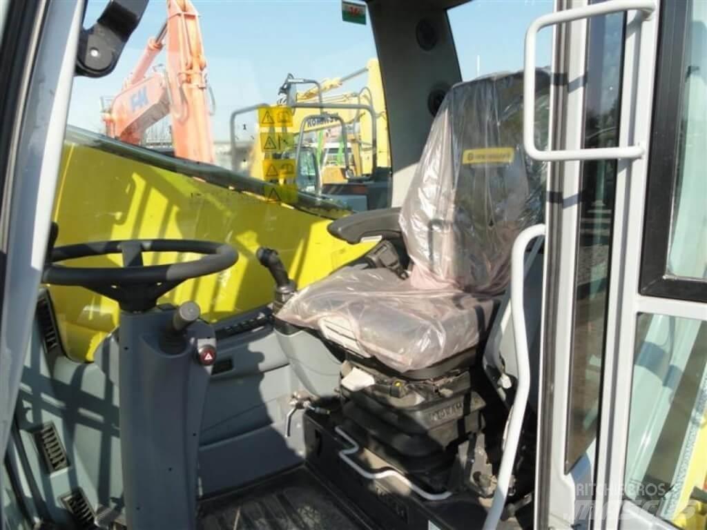 New Holland WE210 Колісні екскаватори