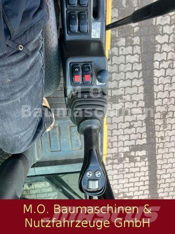 CAT MH 3022 Колісні екскаватори