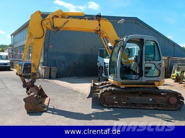 New Holland E70SR 4 Екскаватори-навантажувачі