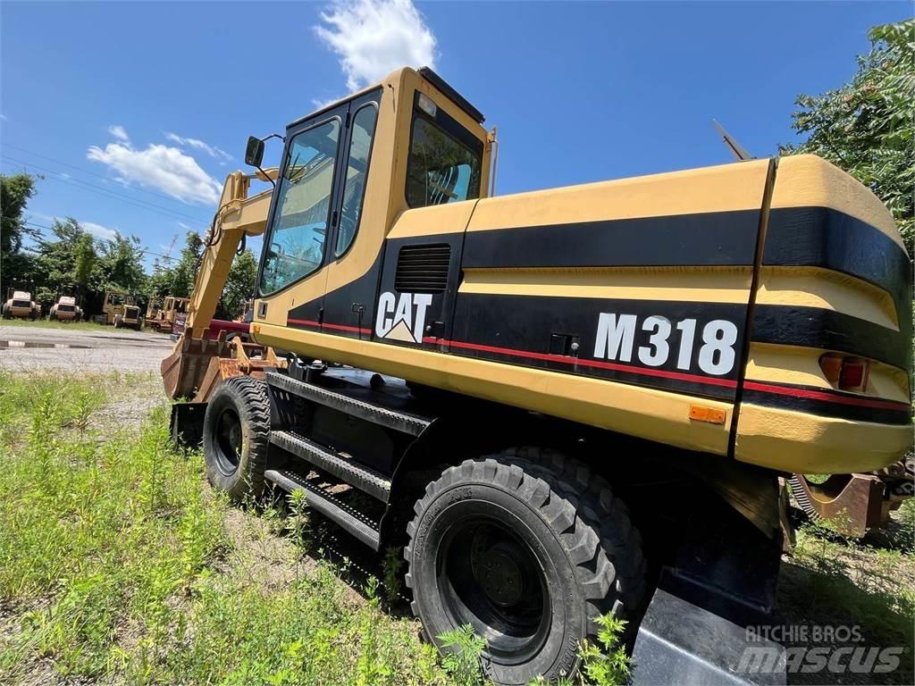 CAT M318 Колісні екскаватори
