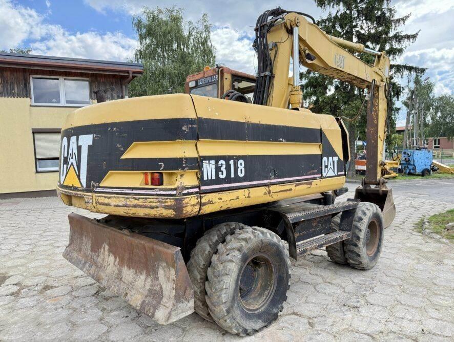 CAT M318 Колісні екскаватори