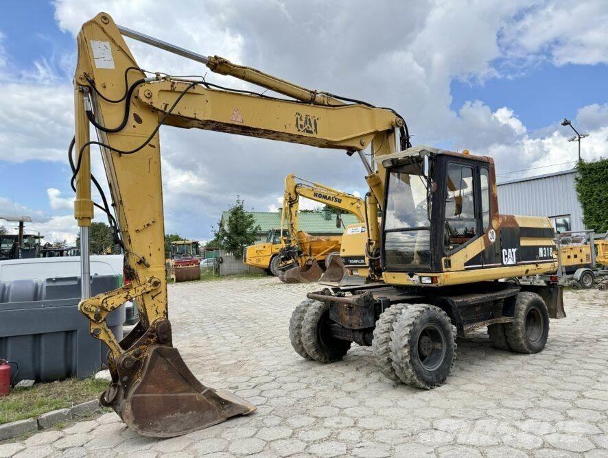 CAT M318 Колісні екскаватори