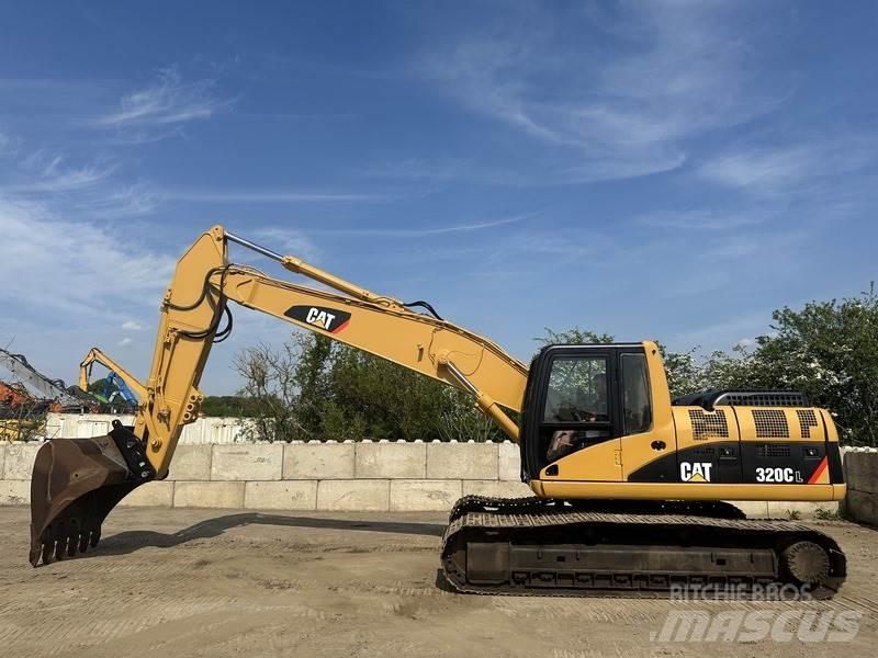 CAT 320 Гусеничні екскаватори