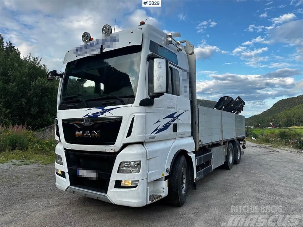 MAN TGX 26.560 Flatbed truck with Hiab 138 crane from  Вантажівки-платформи/бокове розвантаження